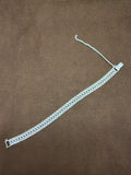 A55 925 sterling silver bracelet featuring multiple rows of textured rectangular links, rectangular clasp and safety chain.