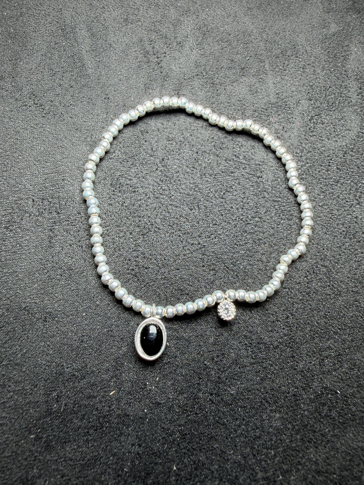 A23 Black Oval Charm Silver Stretch Bracelet