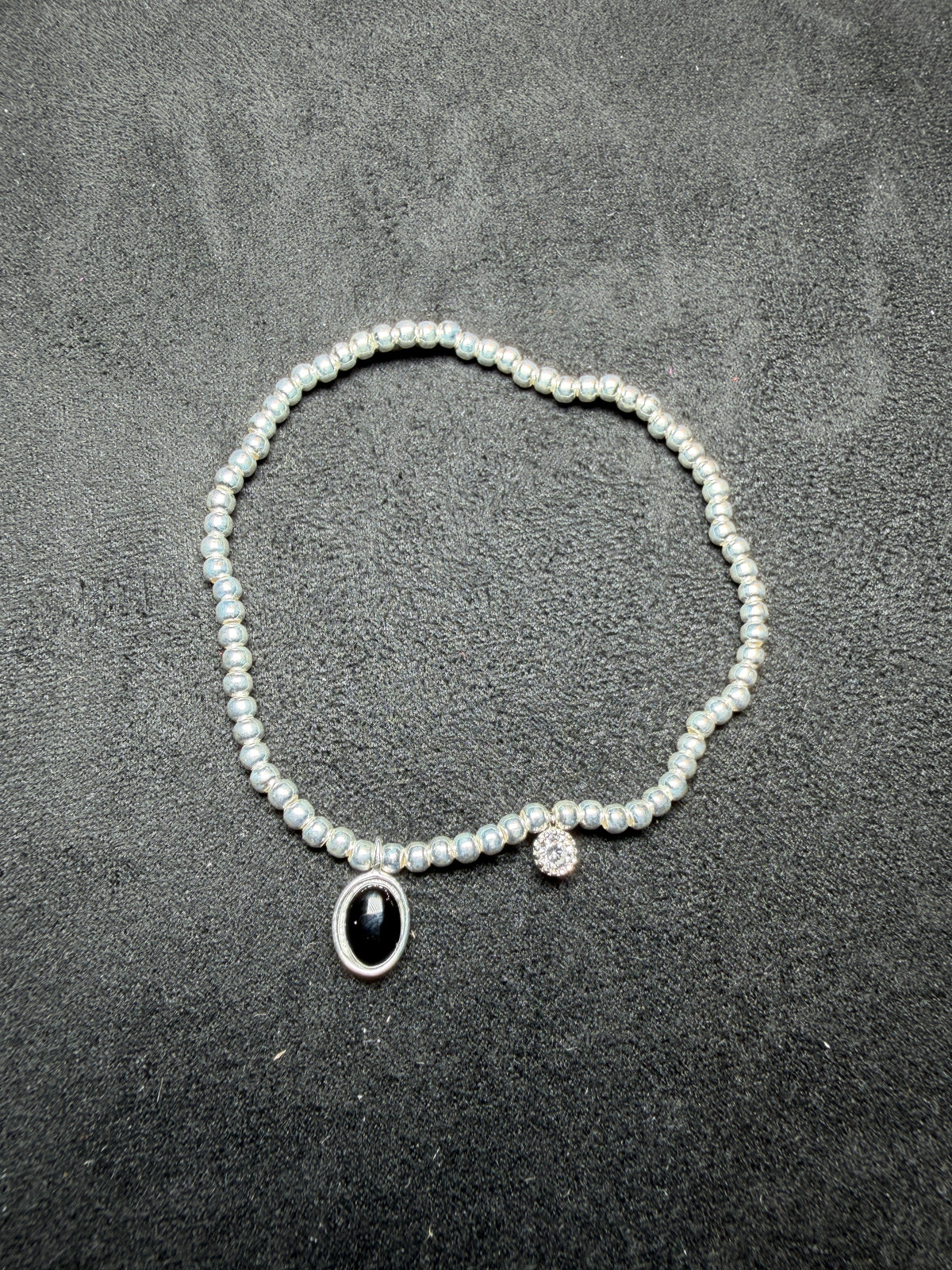 A23 Black Oval Charm Silver Stretch Bracelet