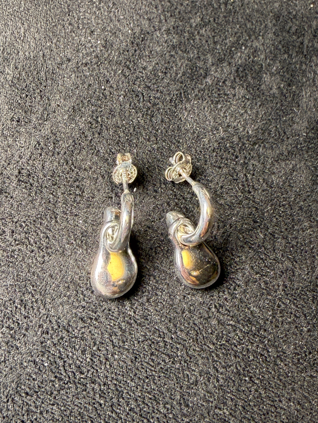 A04 Molten Loop Silver Earrings