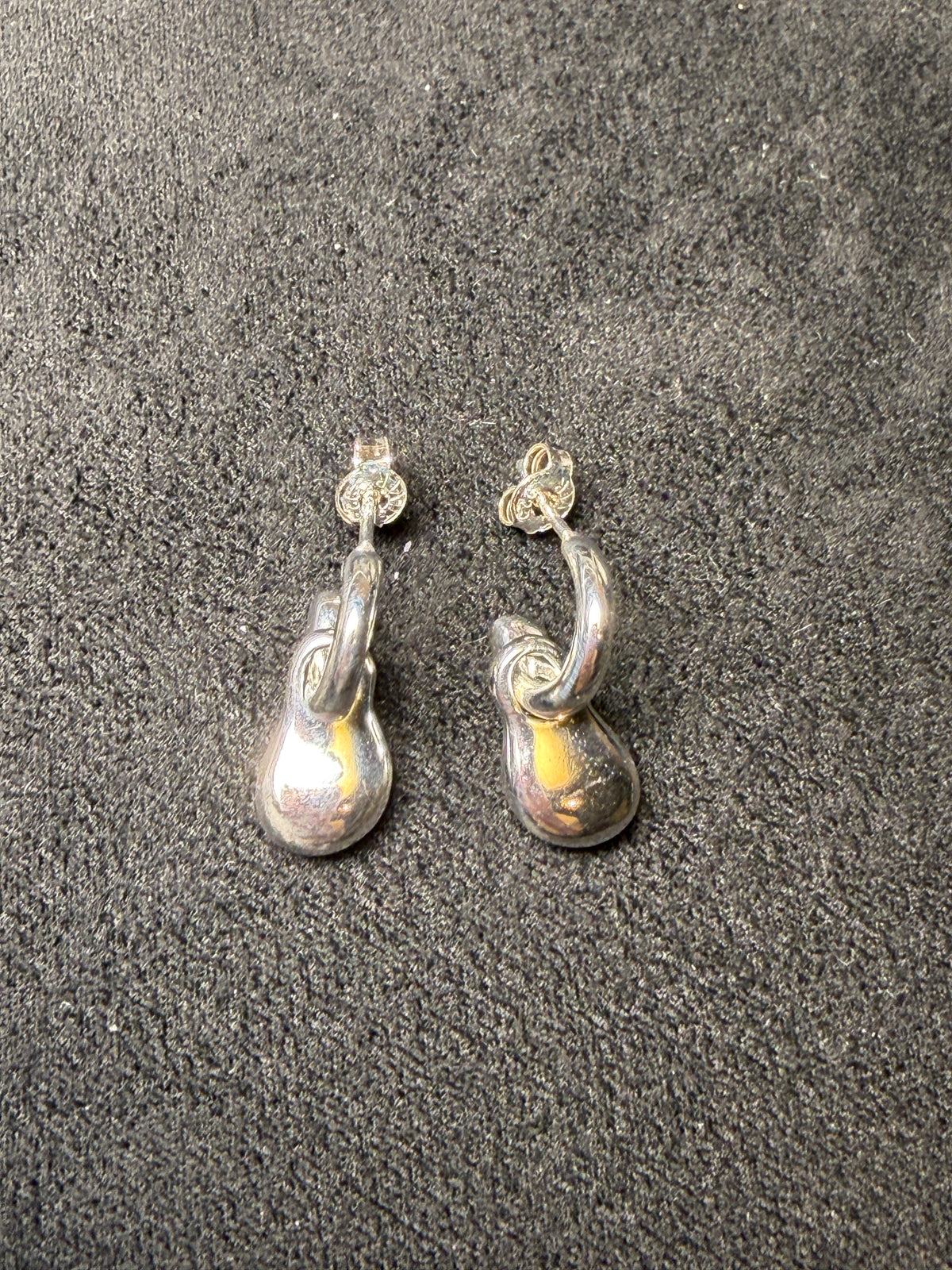 A04 Molten Loop Silver Earrings