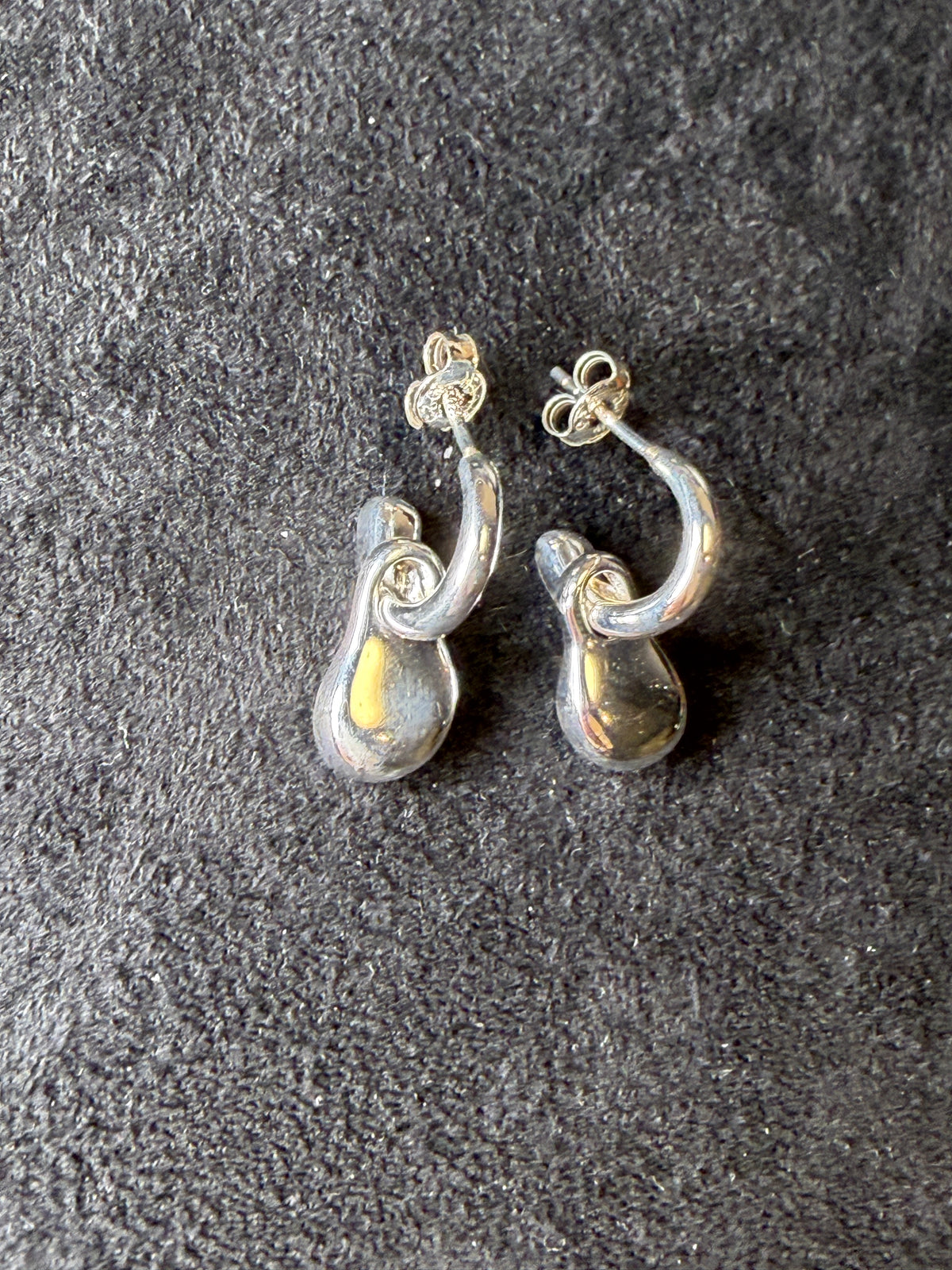 A04 Molten Loop Silver Earrings