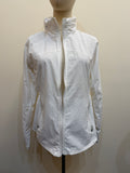 Front view of the H67 white stand-collar jacket on a mannequin, showing a full-length zip, curved panel seams and two zip pockets.
