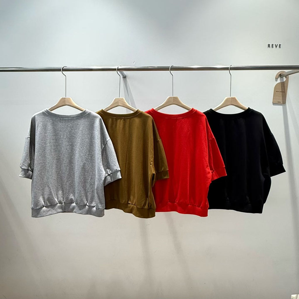 Back views of four H62 half-sleeve jackets on hangers, arranged in gray, brown, red and black, showing plain backs and banded hems.